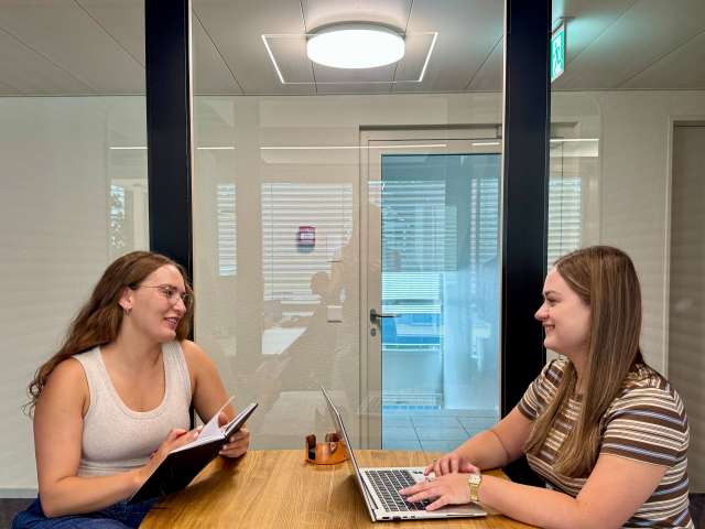 Two women at a desk